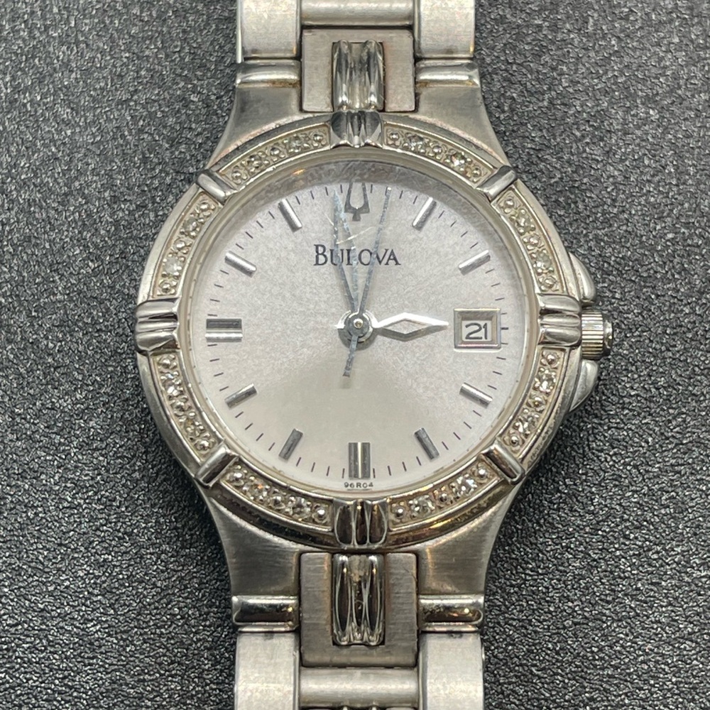 Bulova 96R04 with gemmed bezel, Roman Numerals, and Date Window